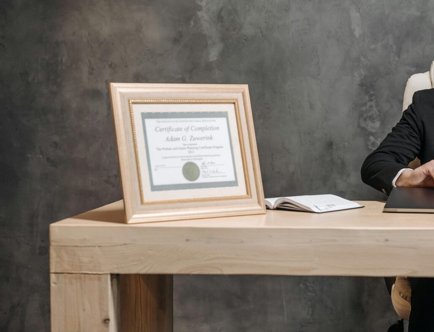 A bearded lawyer working at his office desk, showing professionalism and expertise.